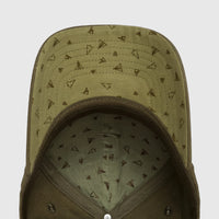 Green cap, underside view, with a geometric tent pattern on the brim and inner crown. Shows detailed stitching and two metal