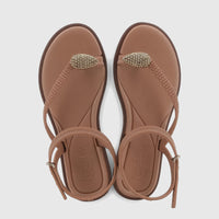 Pair of Grendha Icone GGL19379 brown thong sandals with beaded toe straps and ankle buckles, presented from a top-down view.
