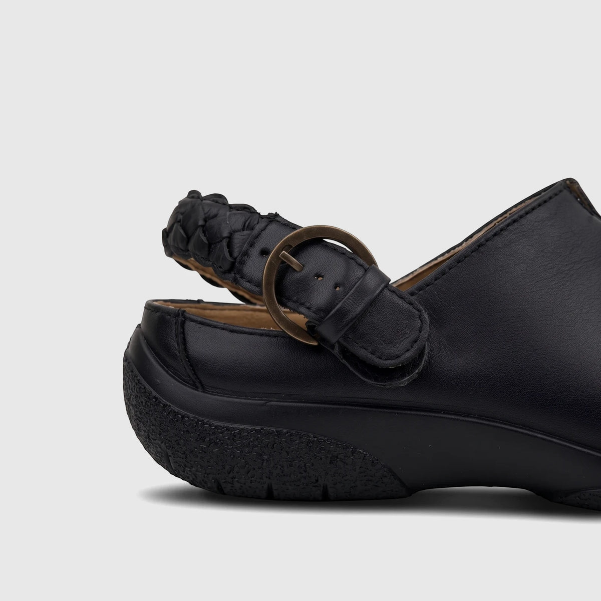 Hotter Ladies Comfort Clog HT116 in black leather, showing a braided strap with a metal buckle and a textured sole. Side
