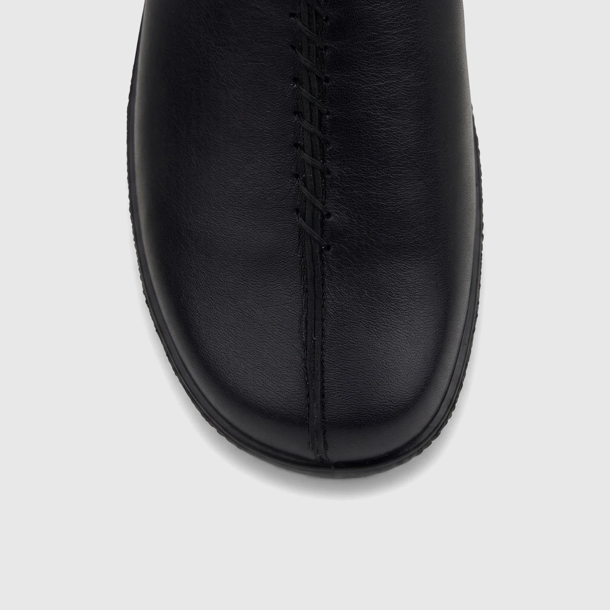 Close-up of the toe of a Hotter Ladies Comfort Clog in black leather, featuring detailed central stitching.