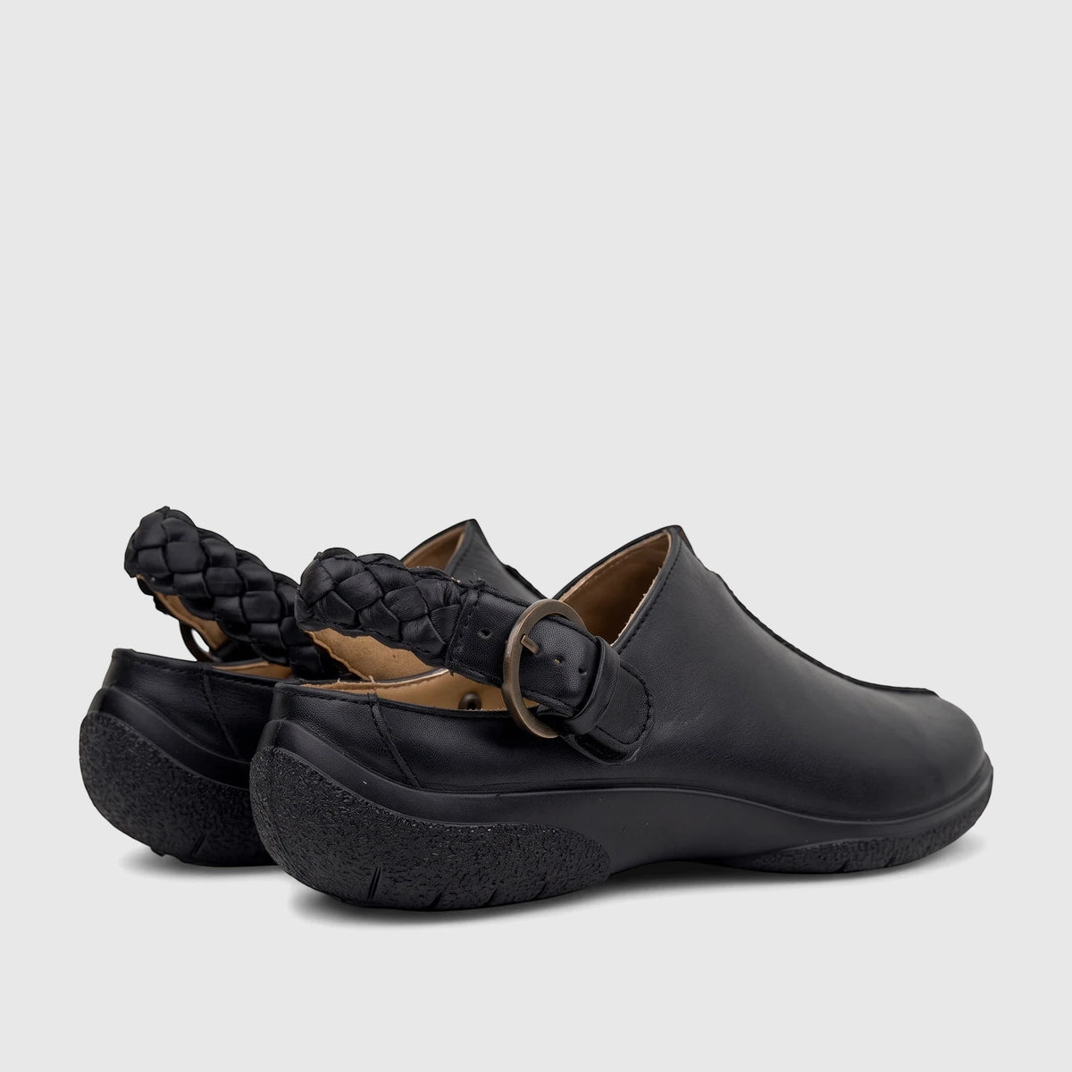 Hotter Ladies Comfort Clog in black leather, featuring a braided heel strap and metal buckle, viewed from the rear-side.