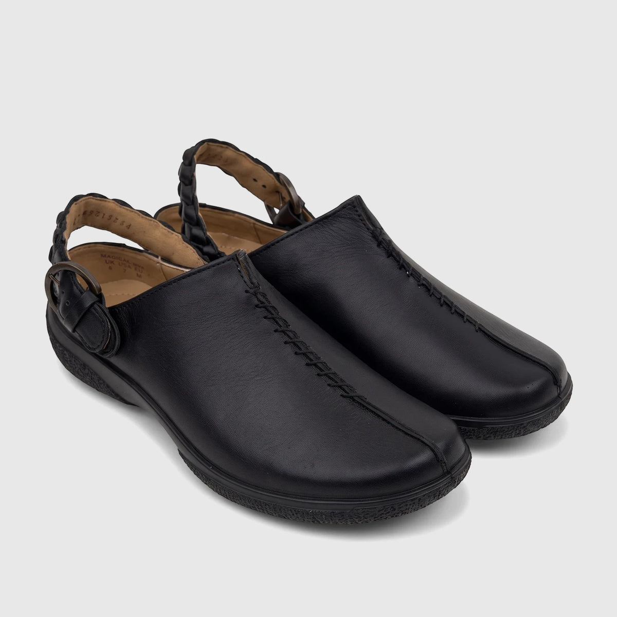 A pair of Hotter Ladies Comfort Clog Magical Black Leather HT116, featuring a braided ankle strap and a buckle, seen from a