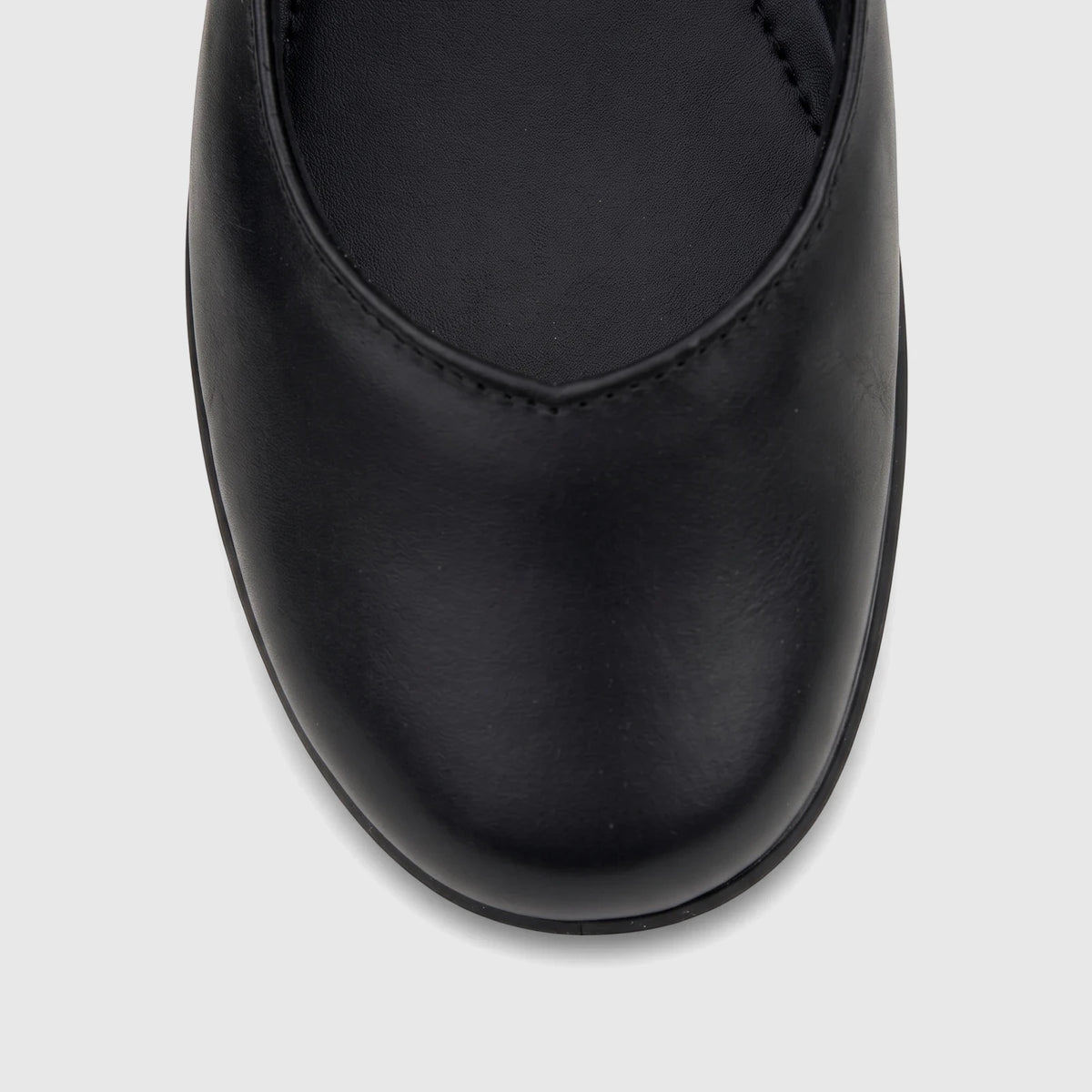 Close-up top view of a Hotter Ladies Comfort Pump Birdie shoe in black smooth leather, showing the toe and front.