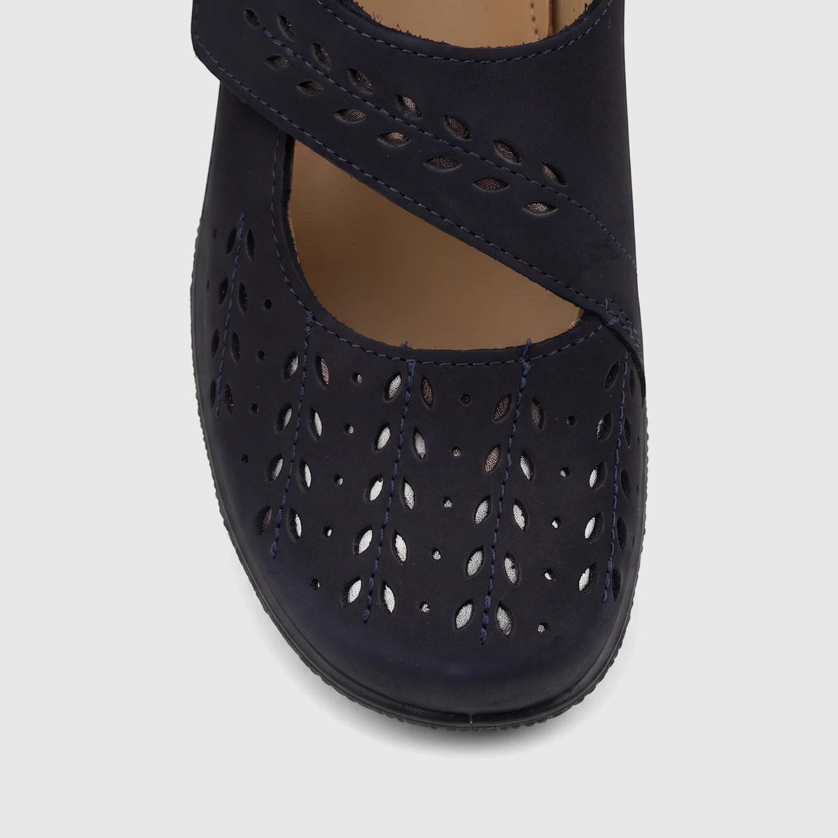 Front view of Hotter Ladies Comfort Pump Daphne Navy HT105, featuring intricate laser-cut patterns on soft navy material.