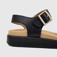 Hotter Ladies Comfort Sandal Corfu Black HT112 with gold buckle and tan footbed, side view.