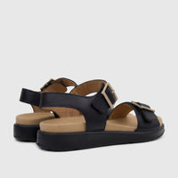 Hotter Ladies Comfort Sandal Corfu Black, featuring black leather straps, a beige insole, and gold-colored buckles, viewed
