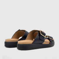 Two Hotter Ladies Comfort Sandals Corsica in navy blue leather with gold buckles, shown from a side-rear perspective.