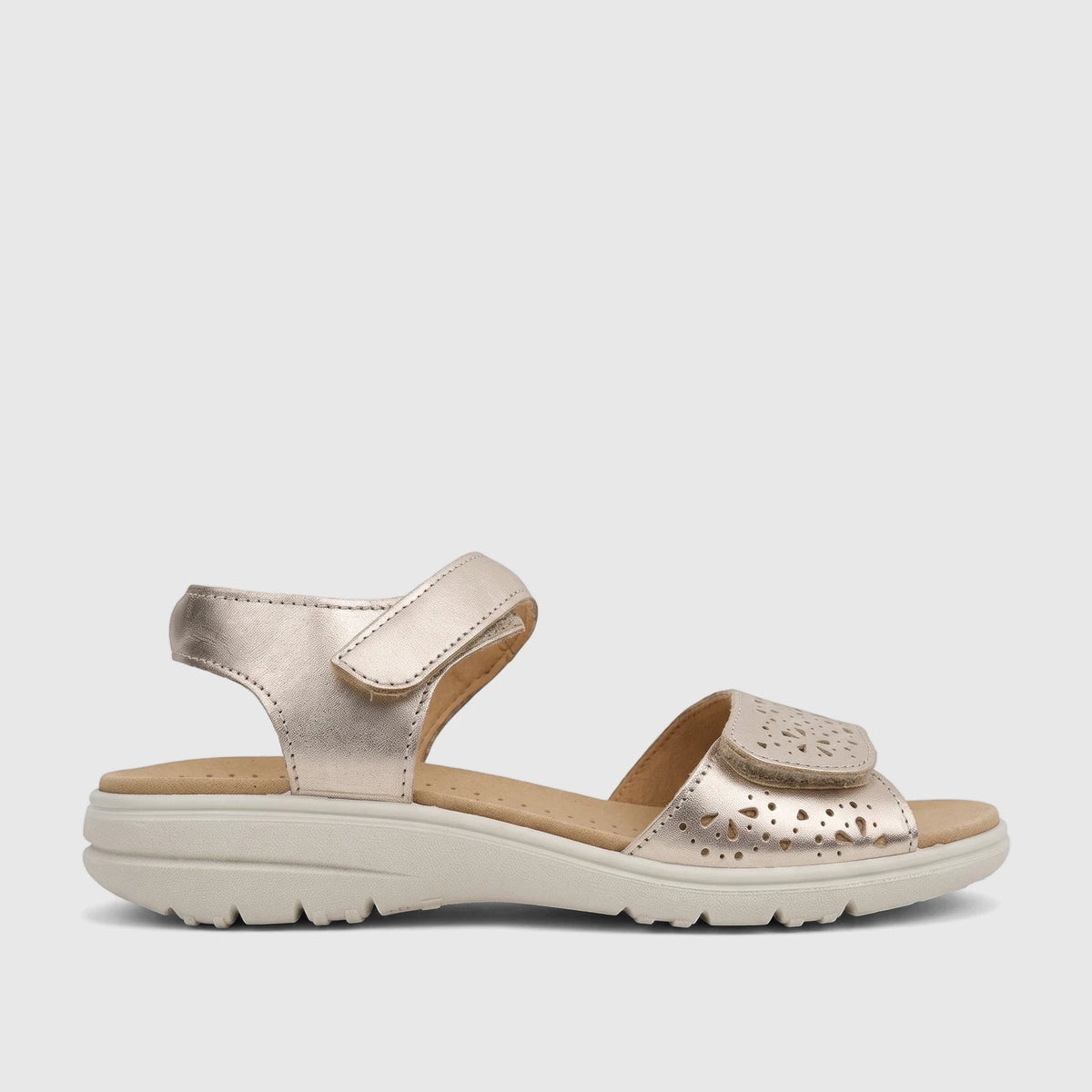 Hotter Leah 2 comfort sandals in soft gold, featuring hook-and-loop straps and perforated details, shown from the side.