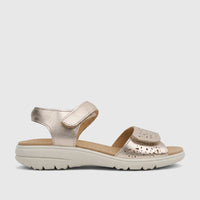 Hotter Leah 2 comfort sandals in soft gold, featuring hook-and-loop straps and perforated details, shown from the side.