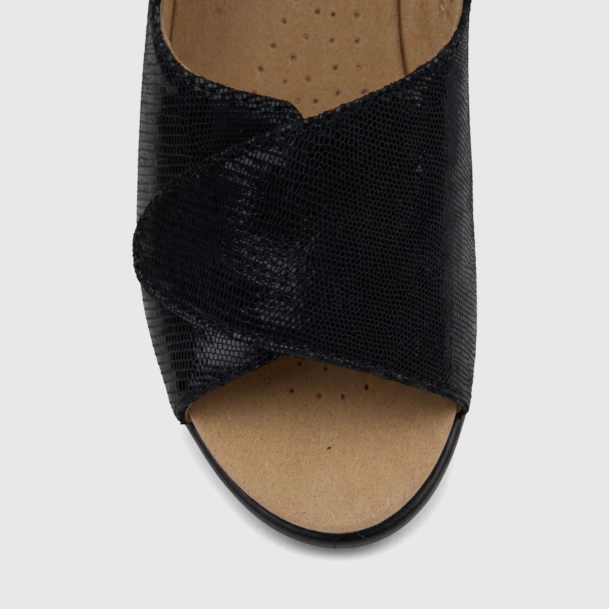 Close-up of a Hotter Ladies Comfort Sandal Olivia in black with a textured, cross-over strap upper and an open-toe design.
