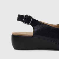 Hotter Ladies Comfort Sandal Olivia Black HT108, close-up side view of a women's black leather wedge sandal with a buckle
