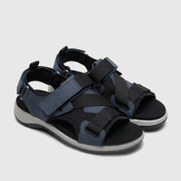 A pair of Hotter Ladies Comfort Sandal Pursue HT107 in aquatic blue and black with grey soles, featuring multiple adjustable