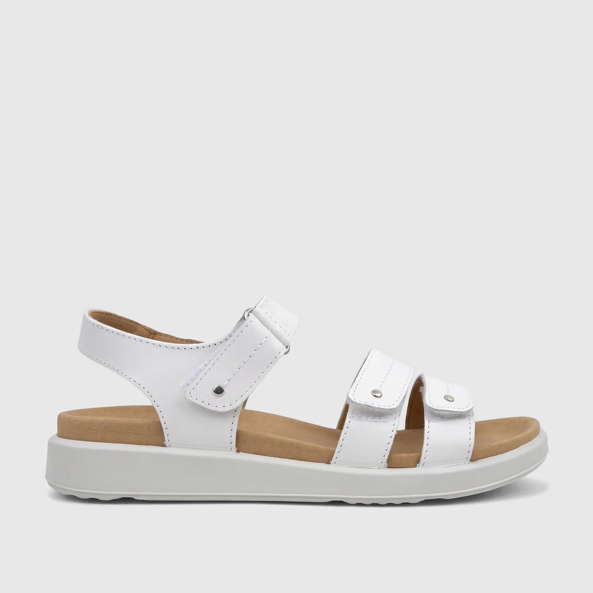Side profile of a Hotter Ladies Comfort Sandal Venice White, featuring a white leather upper with adjustable velcro straps