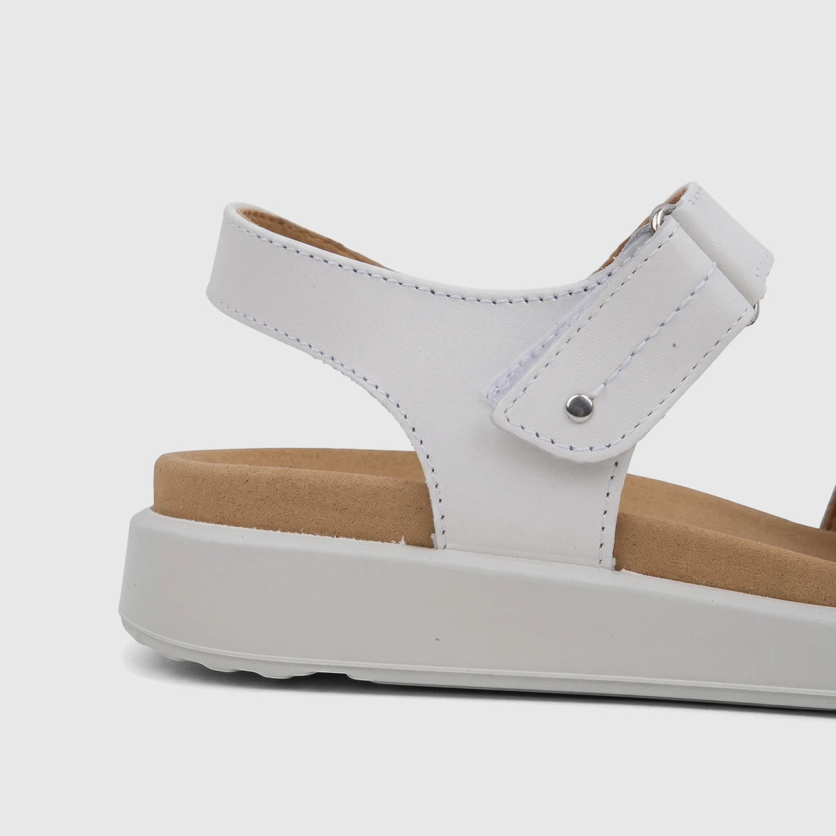 Close-up side view of a Hotter Ladies Comfort Sandal Venice in white, featuring multiple straps, a cork footbed, and a white