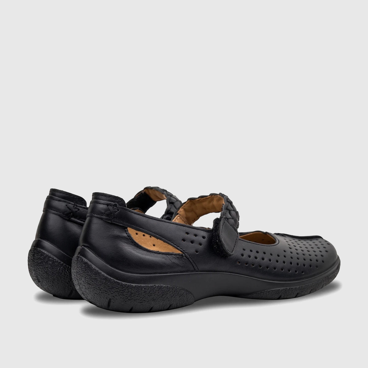 A pair of black Hotter Ladies Comfort Shoe Quake 2, with perforated details and a braided Mary Jane strap.