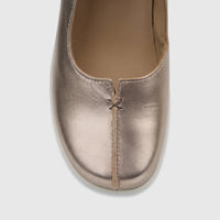 Close-up of a Hotter Ladies Comfort Shoe Shake 2 in rose gold metallic leather, featuring detailed stitching on the vamp.