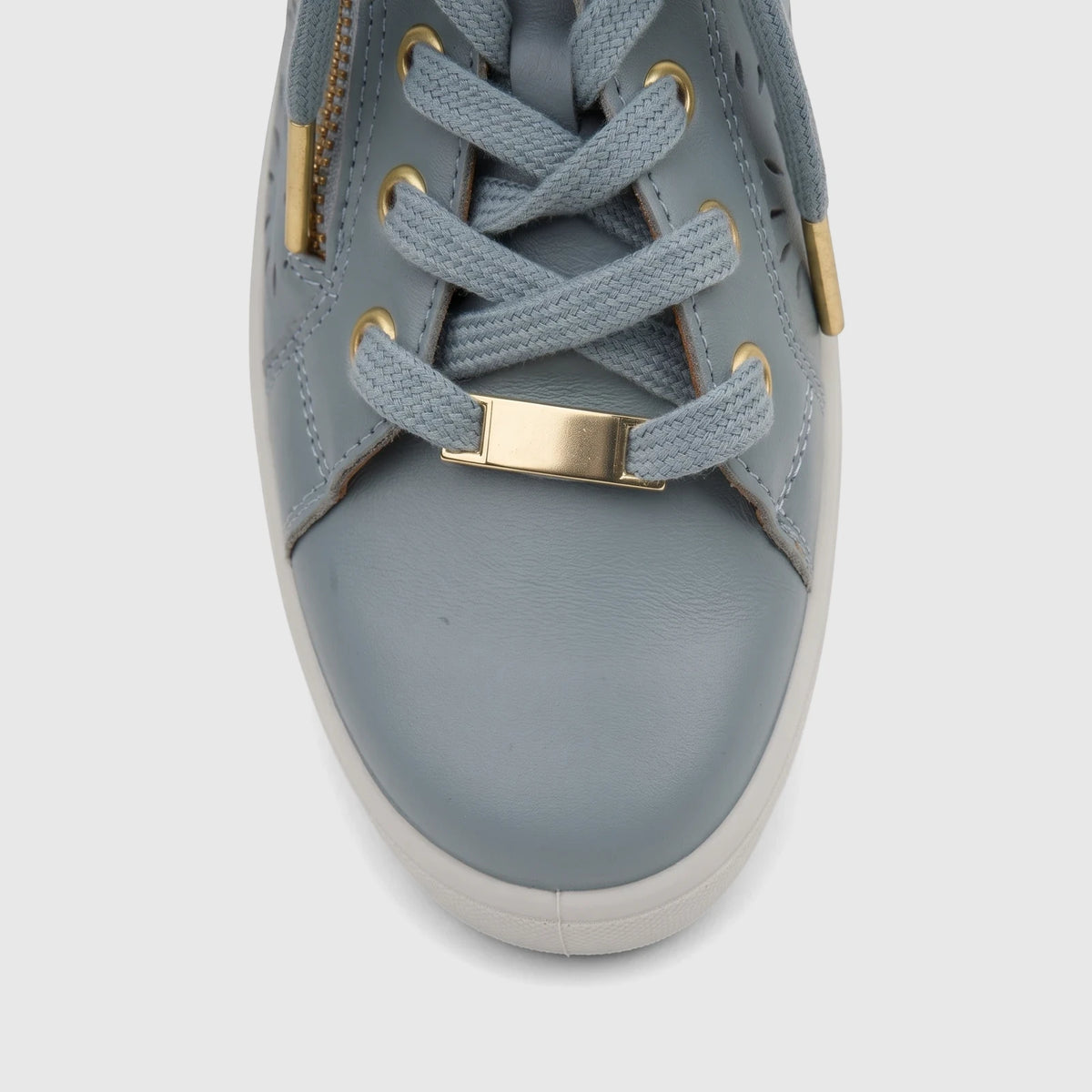 Close-up front view of a Hotter Ladies Comfort Sneaker Wonder in sage perforated leather with gold eyelets and lace bar.