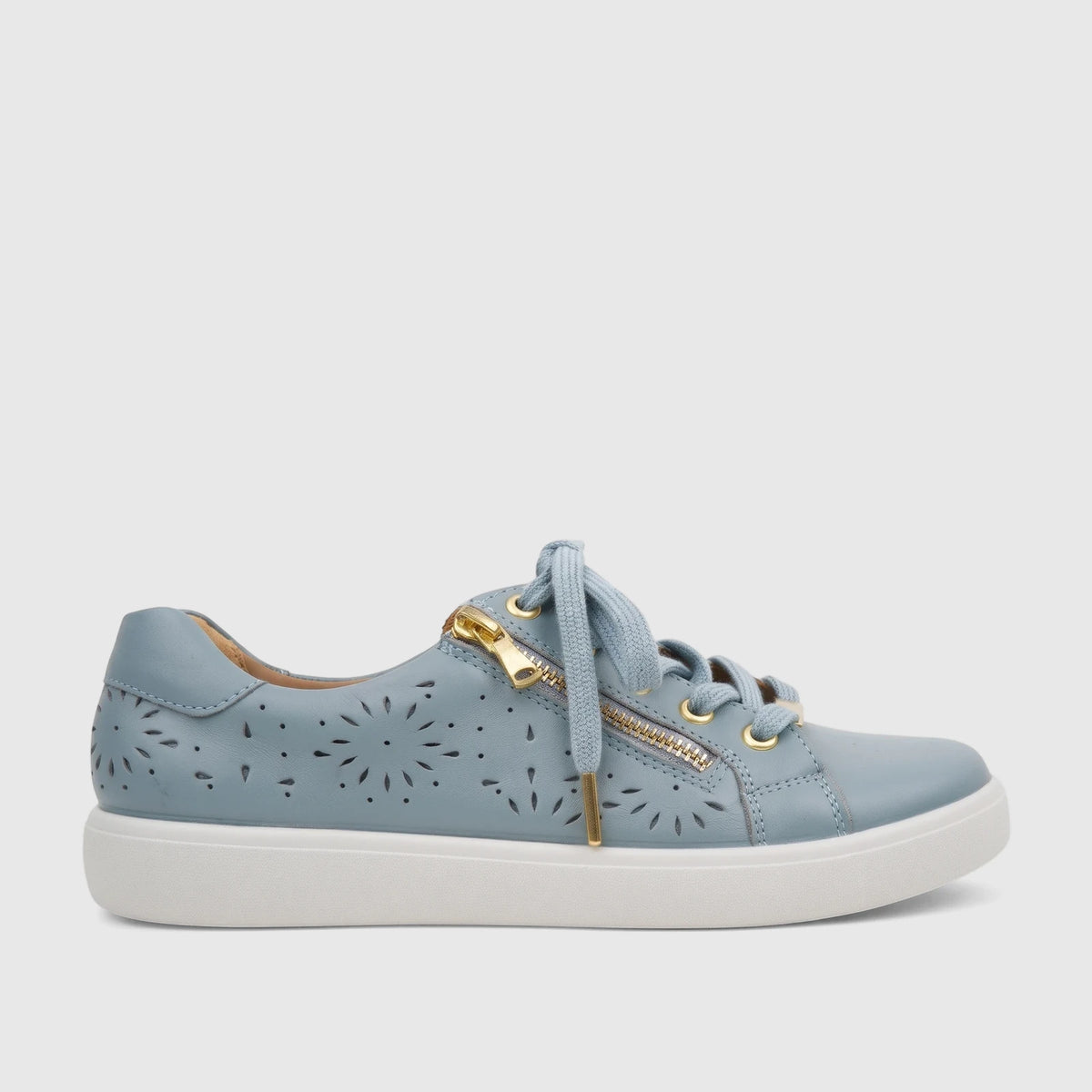 Light blue perforated leather women's comfort sneaker with gold zippers and laces, viewed from the side.