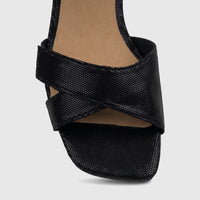 Close-up of a Hotter Ladies Riviera Black Block Heel Sandal, featuring a black criss-cross strap design and a square toe.