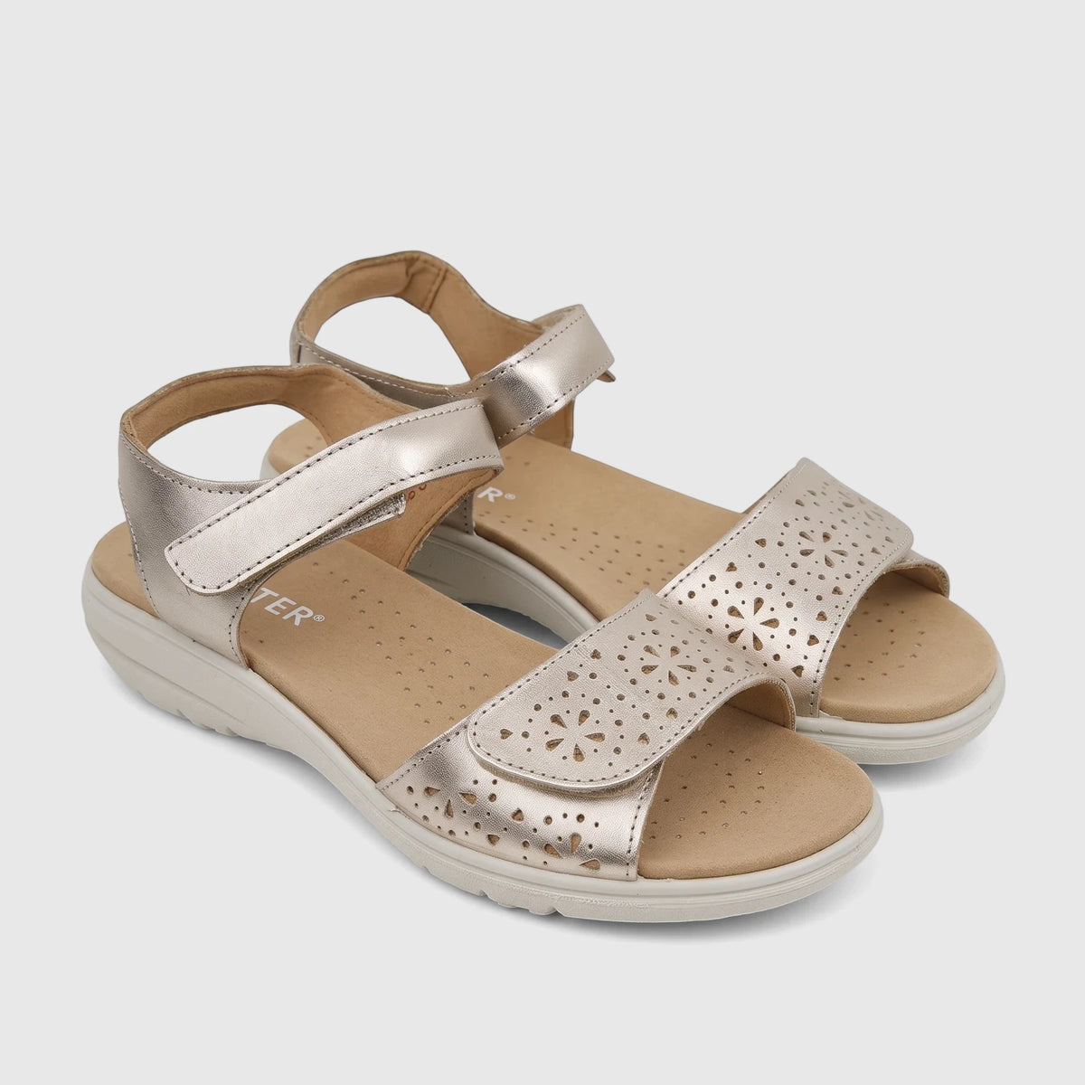 Pair of Hotter Leah 2 comfort sandals in a soft gold finish, featuring laser-cut detailing and adjustable velcro ankle