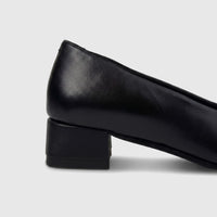 HP Ladies Comfort Block Heel pump in black leather, featuring a sturdy block heel. Side view of the shoe.