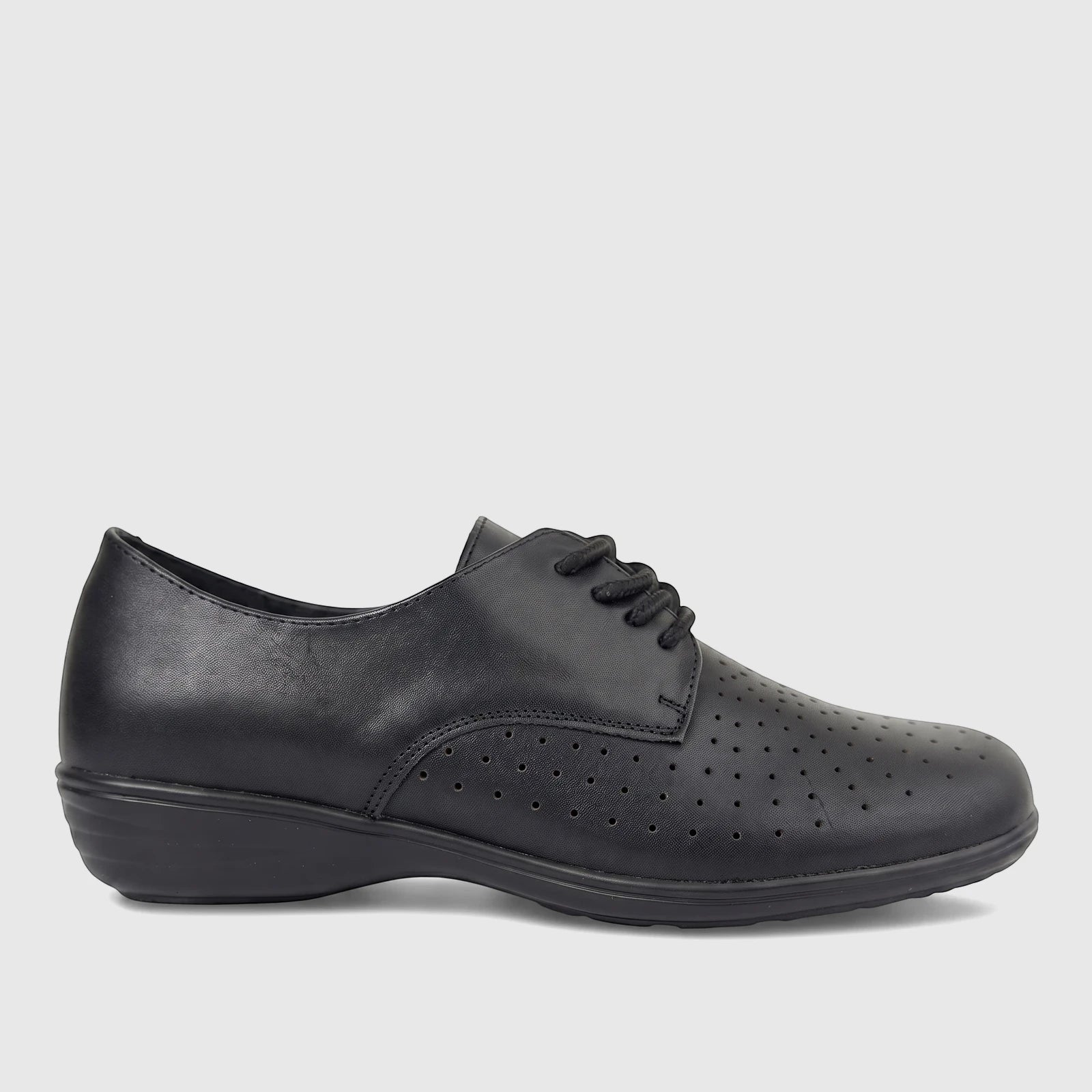 Black leather women's comfort lace-up shoe with perforated details and a low wedge heel, photographed from the side.