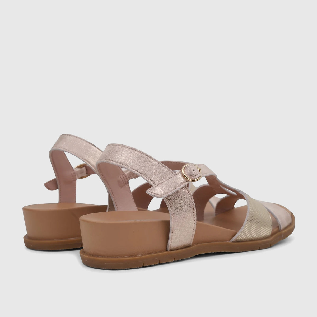 HP Ladies Comfort Sandal Baby Ines in pink metallic, shown from a rear-side angle with gold accents and a flat sole.
