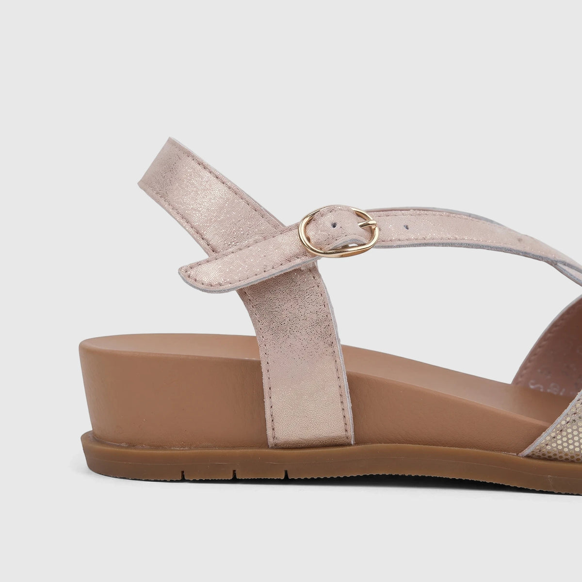 HP Ladies Comfort Sandal Baby Ines in pink metallic, featuring a gold buckle ankle strap and a tan platform sole.