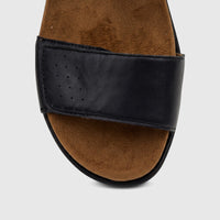 Close-up view of a black HP Ladies Comfort Sandal Saria HPL01531 with a perforated strap and brown suede-like footbed.