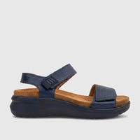 HP Ladies Comfort Sandal Saria in navy blue leather with a brown footbed and dark sole, shown from the side.