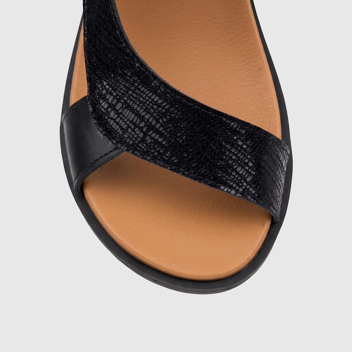 Black HP Ladies Comfort Sandal Zaira with a textured strap and brown footbed, shown from an overhead perspective.