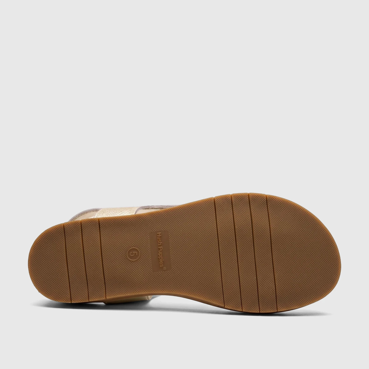 HP Ladies Comfort Sandal Zaira Gold Metallic, with a brown ridged sole showing the Hush Puppies logo and size 5, viewed from
