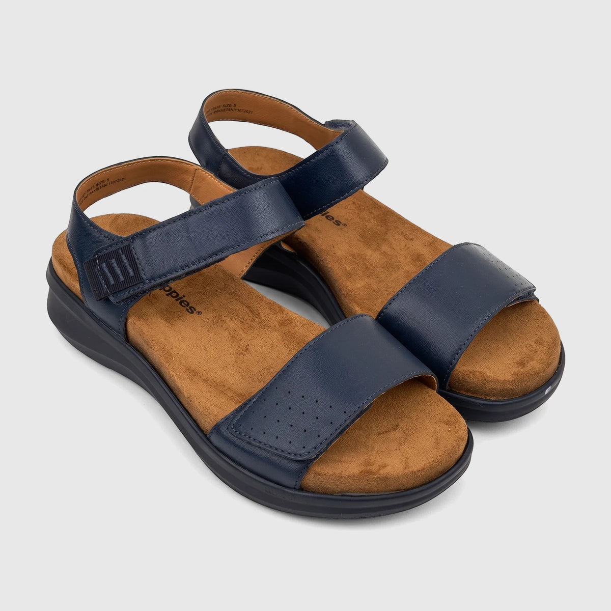 Pair of HP Ladies Comfort Saria sandals in navy blue with tan footbeds and black soles, shown at a slight angle.