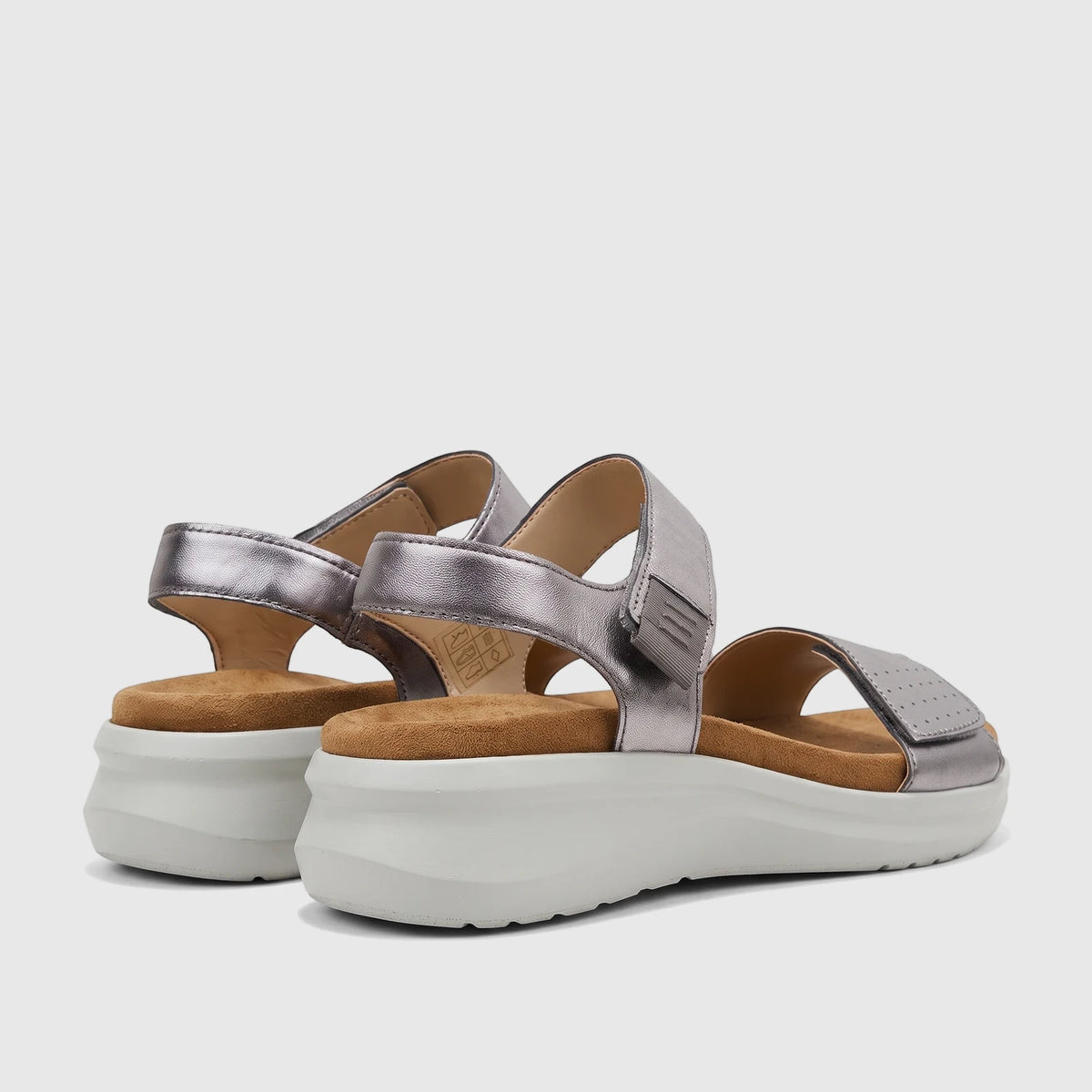 Stone metallic HP Ladies Comfort Saria platform sandals, featuring wide straps and a tan footbed, viewed from a side angle.