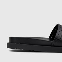 Side profile of a black HP Ladies Comfort Slide Reya sandal, featuring a thick sole and a perforated upper strap.