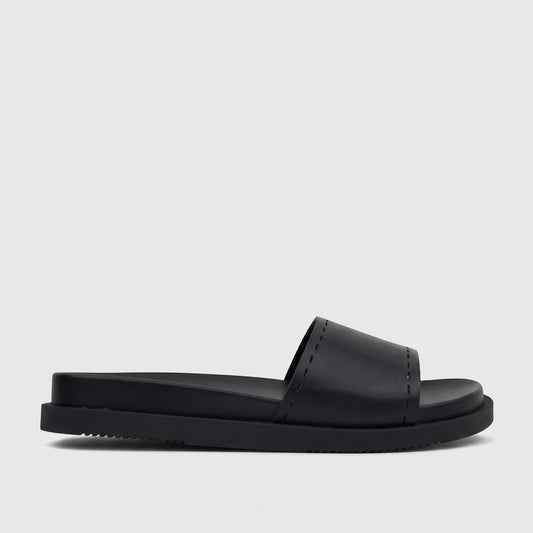 A single black HP Reya comfort slide sandal with a stitched strap, viewed from the side on a white background.