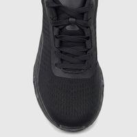 Front close-up view of a single black HP Ladies Comfort Sneaker Maxene featuring a mesh upper and black laces.