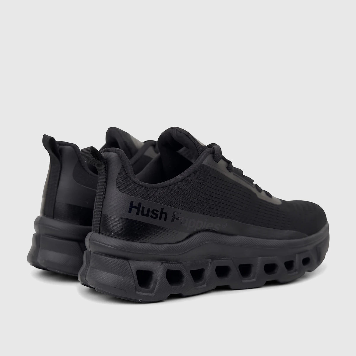 A pair of black HP Ladies Comfort Sneaker Maxene with a chunky sole, viewed from a rear-quarter angle on a white background.