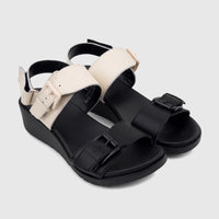 Pair of HP Ladies Comfort Wedge Sandals Noa HPL01518 in black and cream, with adjustable straps and sturdy black wedge soles.