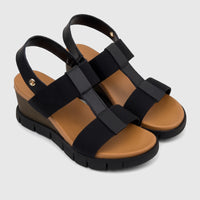 Pair of HP Ladies Comfort Wedge Sandals Nyx HPL01515 Black HL288, featuring black straps, a tan footbed, and a ridged black