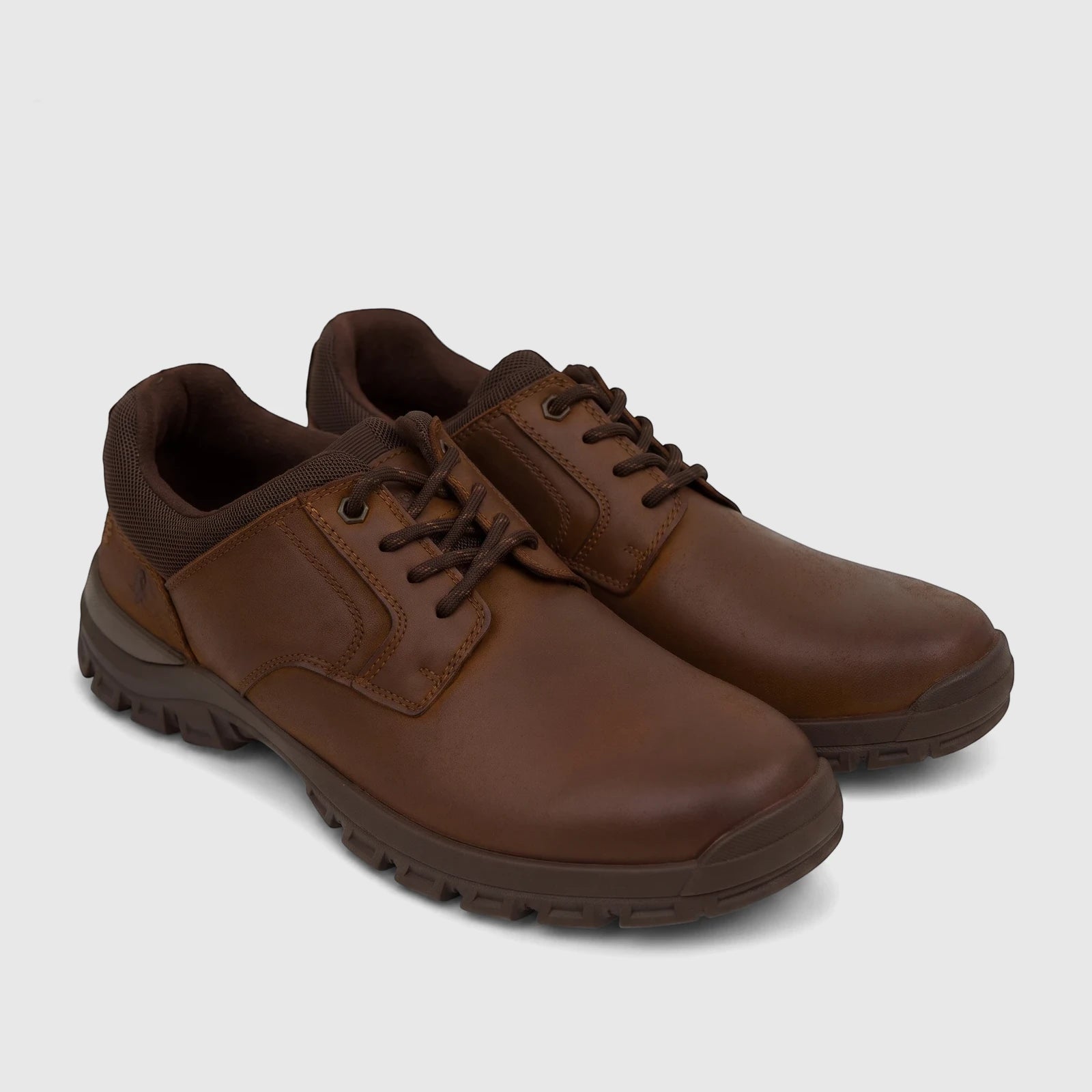 Pair of brown leather men's comfort lace-up shoes, HP Dawie HPM01038, with detailed stitching and rugged soles.