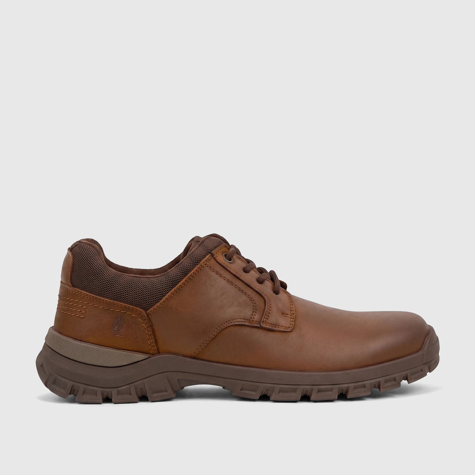 Men's brown comfort lace-up shoe with a textured sole and mesh collar, shown in a profile view.