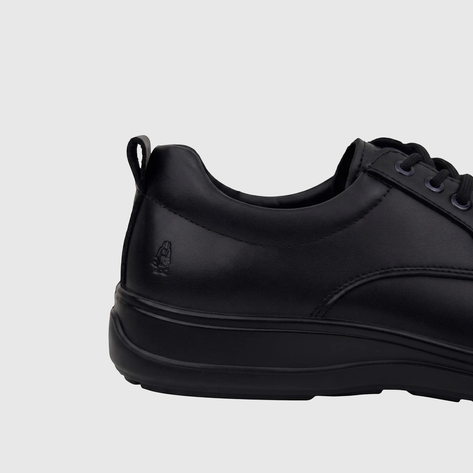 Men's black leather comfort lace-up shoe, side view, showing brand logo and textured upper.