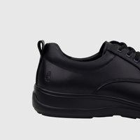 Men's black leather comfort lace-up shoe, side view, showing brand logo and textured upper.