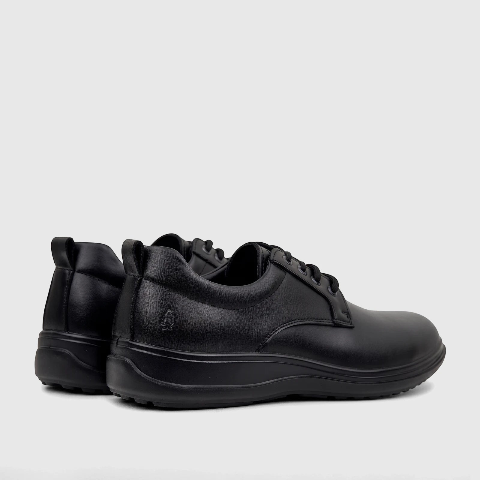 A pair of black HP Men's Comfort Lace Up Stefan shoes, made of leather-like material, shown from a rear-side angle.