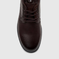 Close-up of a men's HP Comfort Stefan lace-up shoe in chocolate brown leather, featuring dark laces and a sturdy sole.