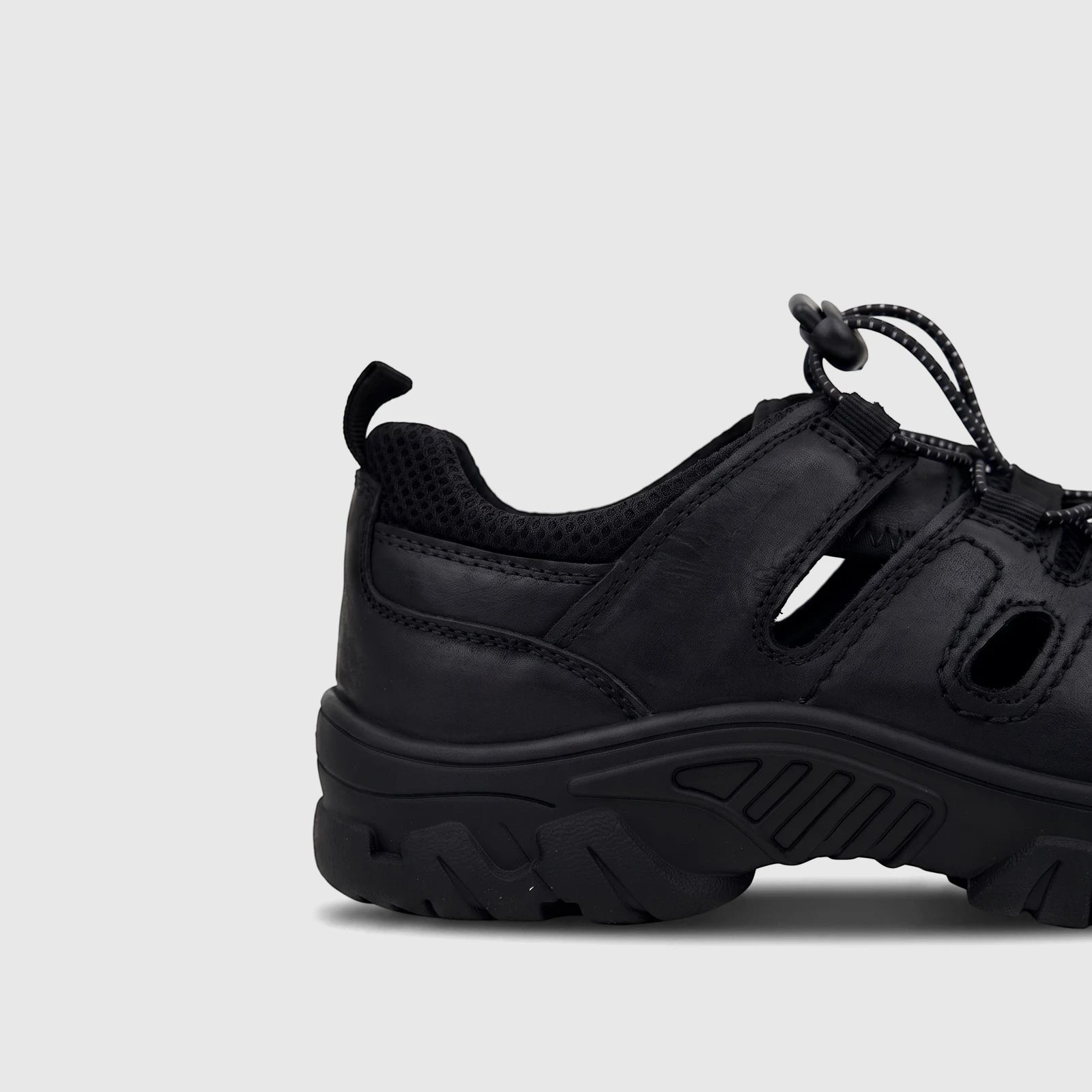 Side view of an HP Men's Comfort Sandal Elio HPM01054 in black, featuring a leather-like upper, bungee lacing, and a chunky