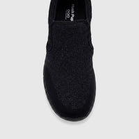Black knit men's comfort slip-on sneaker, front view showing the textured upper and sturdy sole.