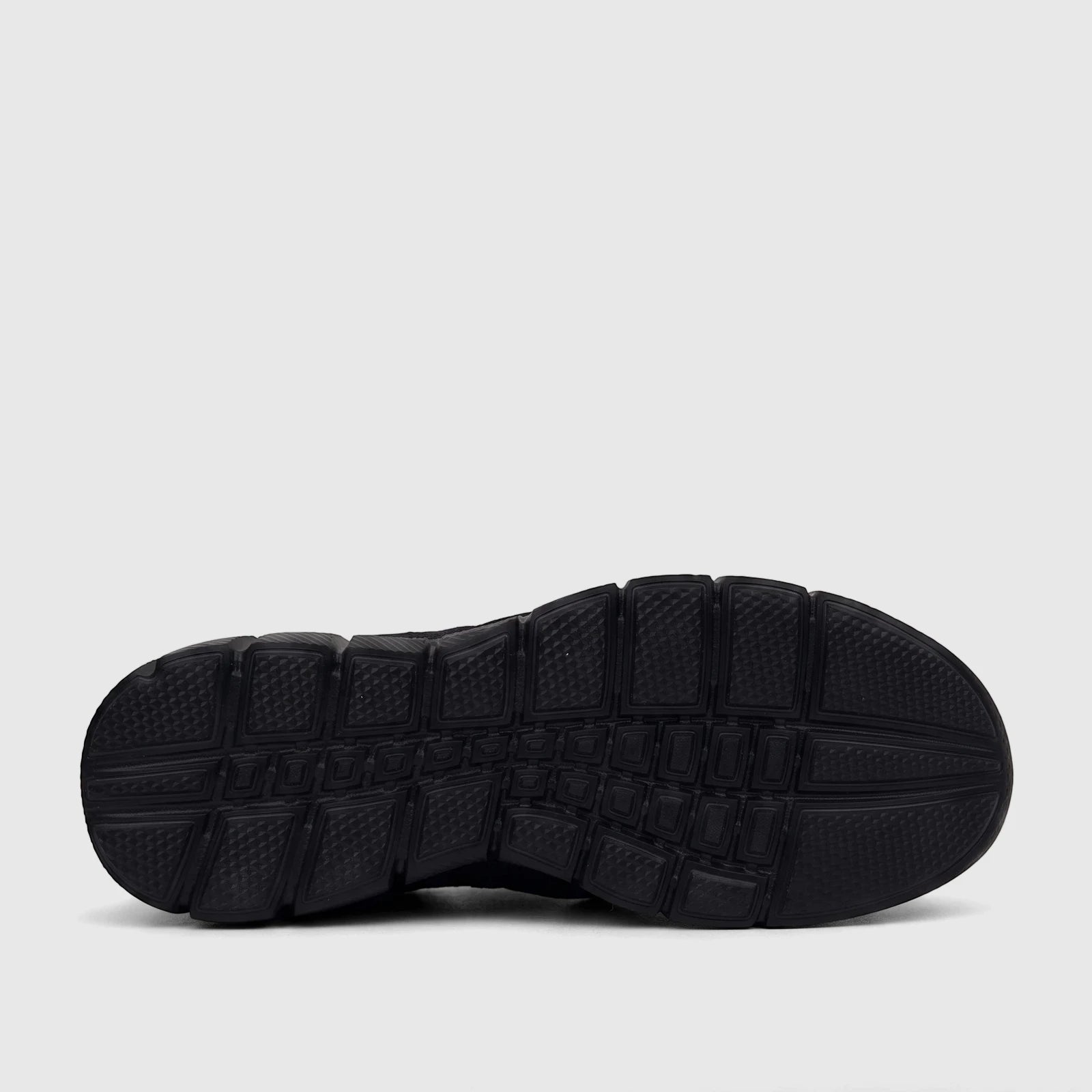 HP Men's Comfort Slip On Sneaker in black, showcasing the textured rubber sole pattern from a bottom view.