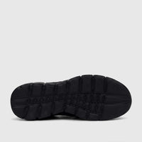 HP Men's Comfort Slip On Sneaker in black, showcasing the textured rubber sole pattern from a bottom view.